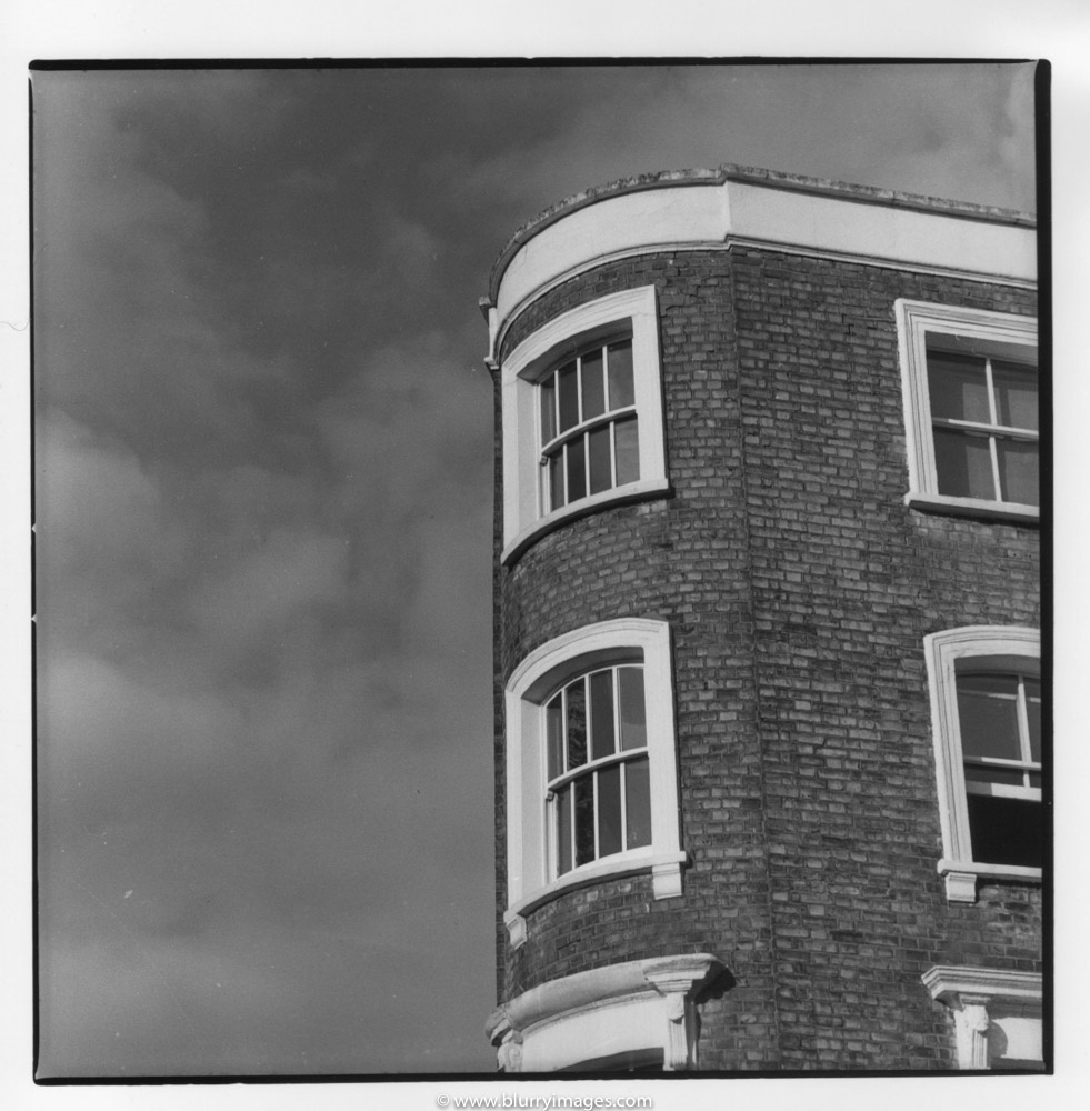 high buildin in london, nottingh hill house, sky and clouds
