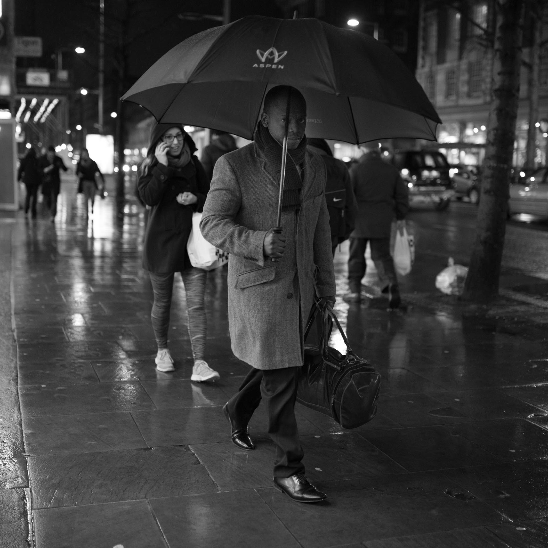 Umbrella & rain, portrait in rain, streetphotography