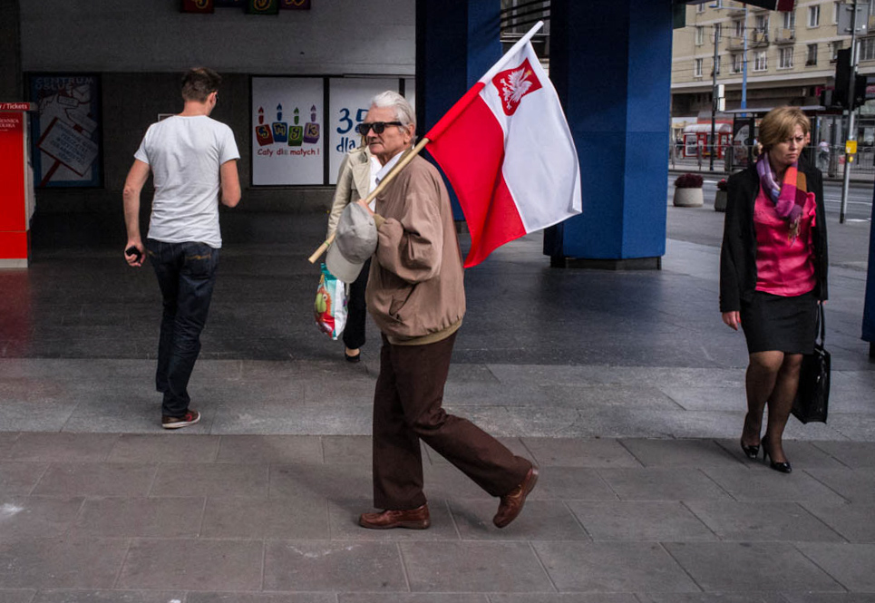Polish flag, man with flag Warsaw