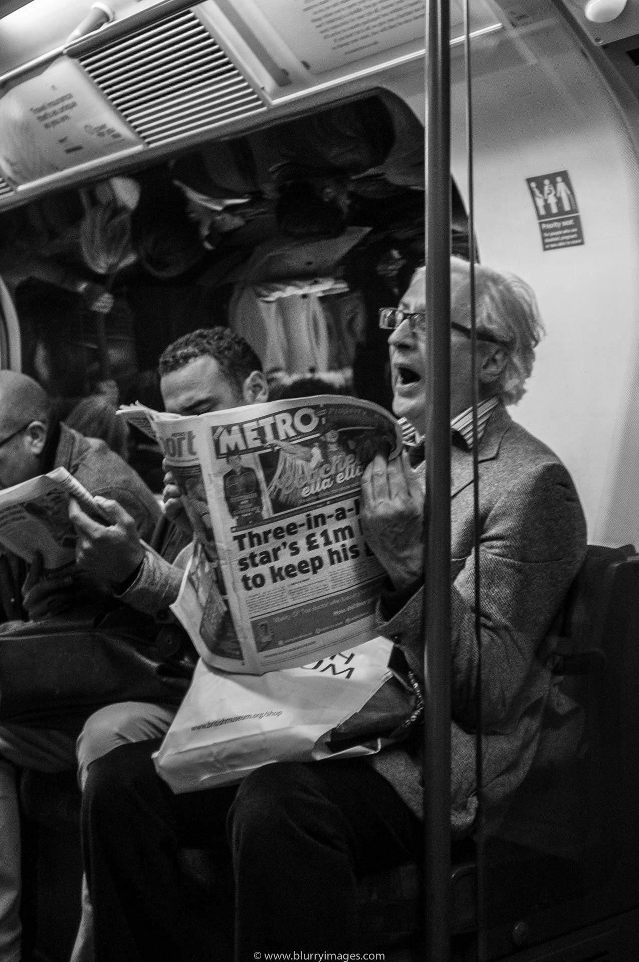 London's tube, runner, jogging, old man, newspaper, reading newspaper, London's underground